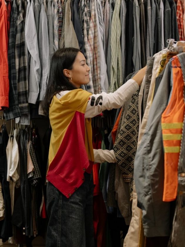 Girl buying secondhand preloved clothing