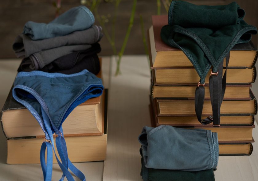 organic bras and organic underwear laying on books