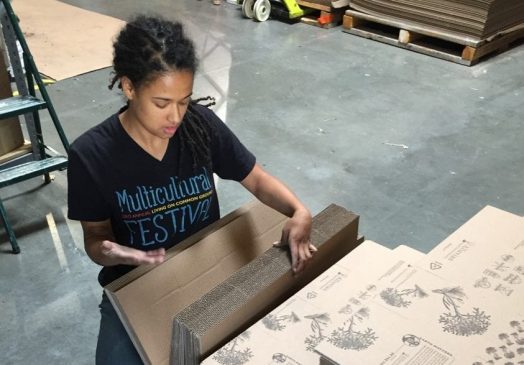 Woman working at Sustainable Packaging facility