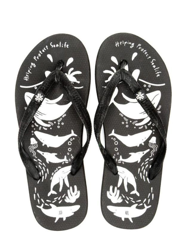 black and white sustainable flip flops made from natural rubber