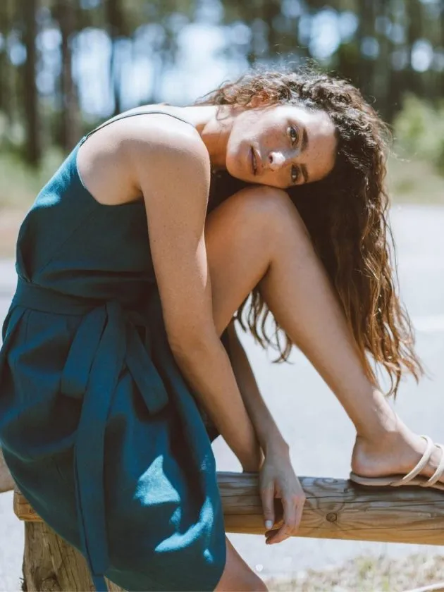 model wearing blue linen dress from linen clothing brand Love and Confuse