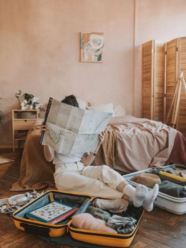 Woman packing suitcases