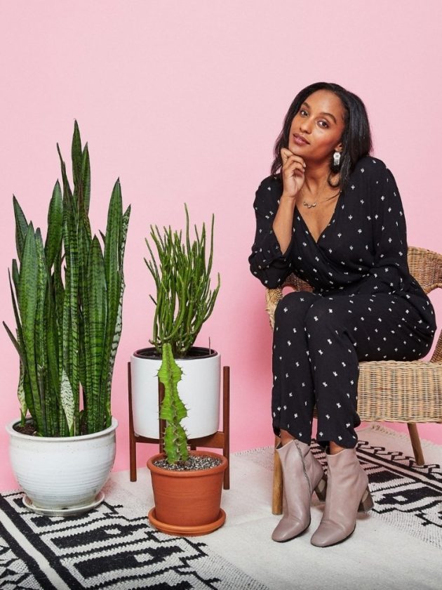 Woman with black jumpsuit sitting on chair - Sustainable and Ethical Alternatives to Amazon - Made Trade