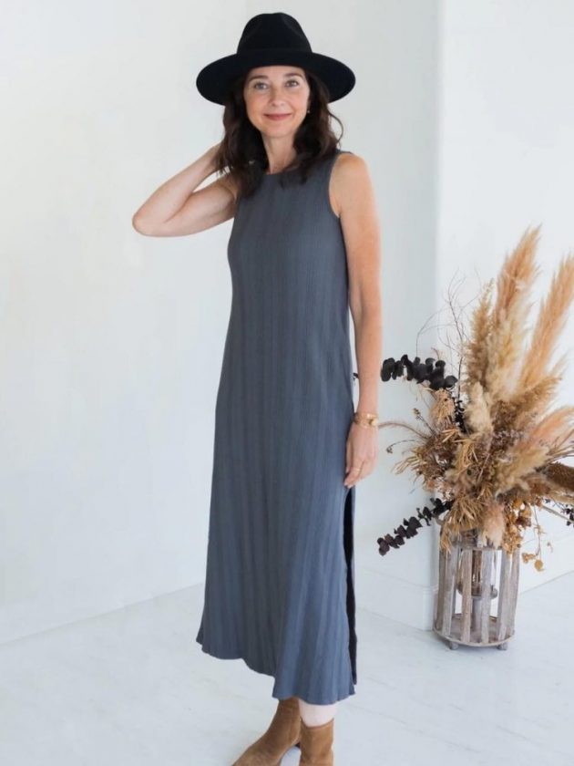 woman wearing long blue sustainable dress