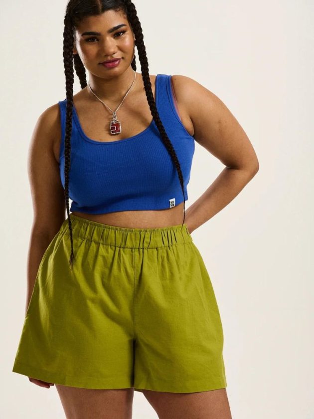 Ethical green shorts and blue sports bra