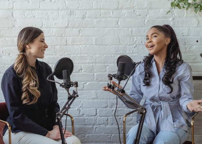 two women talking on a sustainable fashion podcast