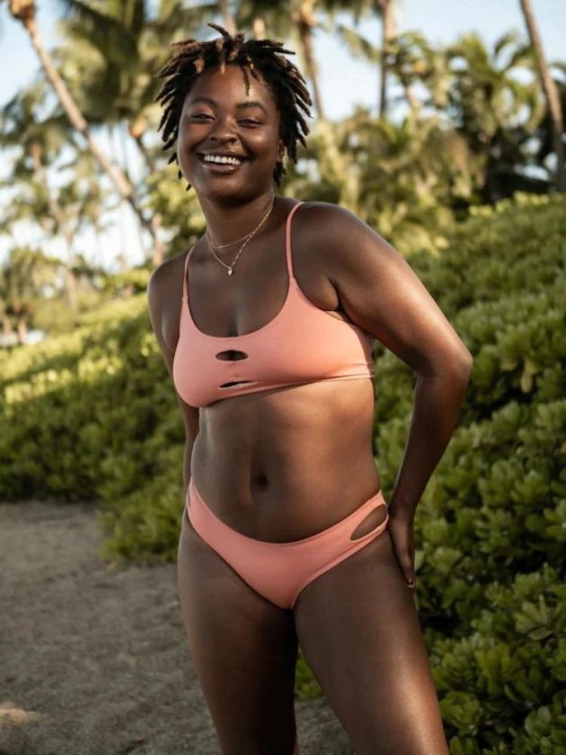 model wearing coral sustainable affordable swimsuit from Sensi Graves