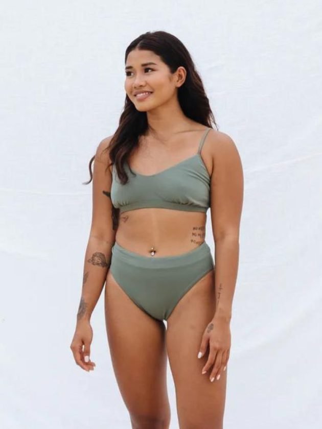 woman waring sage green sustainable bikini